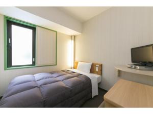 Un televizor și/sau centru de divertisment la R&B Hotel Umeda East - Vacation STAY 15381v