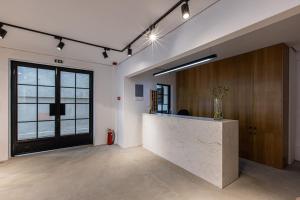 an office with a reception counter and a door at Saint George Hotel Rooms in Komotini