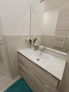 a bathroom with a white sink and a mirror at CASA DI GIO in Sestri Levante