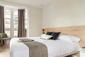 A bed or beds in a room at Albatros