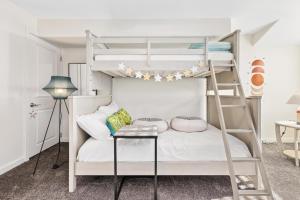 a bedroom with a bunk bed with a ladder at PERFECT 5 STAR - Chelsea Harbor House in Atlantic City