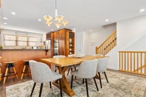 a dining room with a wooden table and chairs at PERFECT 5 STAR - Chelsea Harbor House in Atlantic City