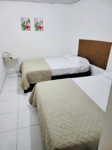 Katil atau katil-katil dalam bilik di Residencial Lassonde Guest House