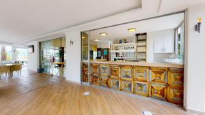 a kitchen with a bar in a house at Moda Beach Hotel in Marmaris