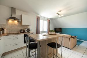 Кухня или кухненски бокс в Le Dixmude, appartement proche plage de Morgat