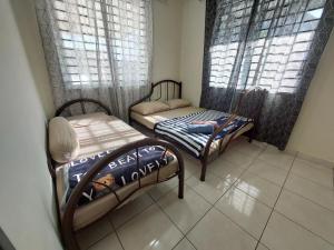 Gulta vai gultas numurā naktsmītnē S99 HOMESTAY KUDAT