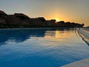 Swimming pool sa o malapit sa Relaxing Studio-Malibu El Sokhna Resort