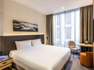 Giường trong phòng chung tại Mövenpick Hotel Hobart