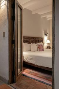 เตียงในห้องที่ Antigua Casona San Blas