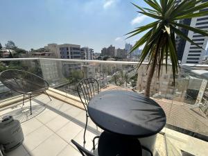 A balcony or terrace at Beautiful 2BR In Ramat Gan