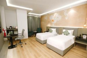 Gulta vai gultas numurā naktsmītnē Regenta Place Amritsar by Royal Orchid Hotels Limited