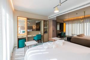 Ліжко або ліжка в номері LUSTER Hotel