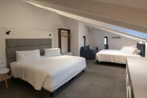 Katil atau katil-katil dalam bilik di Boutique Hotel Touring