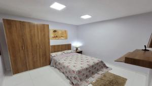 Tempat tidur dalam kamar di Hotel Residencial Manaus - Flores