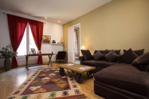 a living room with a couch and a table at BCN Apartments 41 in Barcelona