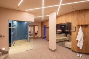 a bathroom with a shower and a glass door at Hotel Zum Schwarzen Bären in Emmersdorf an der Donau