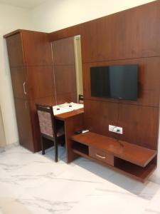 A television and/or entertainment centre at The Amur Falcon Inn & Resorts