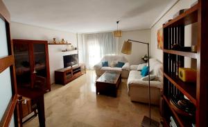 a living room with a couch and a table at Awesome central house with 3 bedrooms in Ceuta