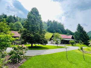 a view of a park with trees and a building at Apartma Butterfly in Škofja Loka