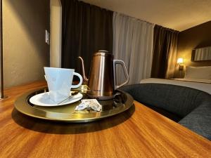 Fasilitas pembuat kopi dan teh di Superior Queen Room-Non Smoking