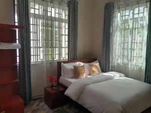 Tempat tidur dalam kamar di Villa Home Apartment Dodoma