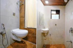 y baño con aseo, ducha y lavamanos. en Moon Lite Residency - Malad West, en Bombay