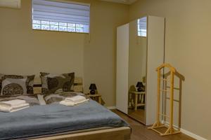 A bed or beds in a room at Szélcsengő Wellness Vendégház