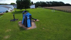 an aerial view of a playground in a field at Coastland Holiday Park in Manorbier