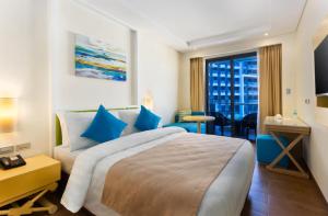 Giường trong phòng chung tại Savoy Hotel Boracay Newcoast