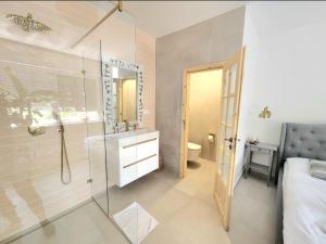 a bathroom with a shower and a sink and a toilet at Ron De Mar #1 modern room in Pezinok