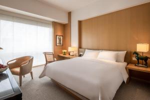 Ένα ή περισσότερα κρεβάτια σε δωμάτιο στο Grand Hyatt Chengdu