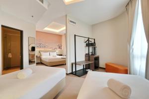 A bed or beds in a room at Cititel Express Ipoh