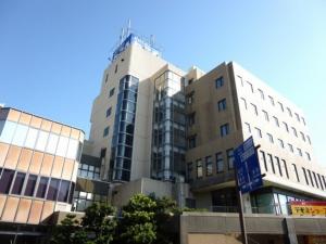 a tall building with a blue sign in front of it at Hotel Wakow - Vacation STAY 22127v in Yonago