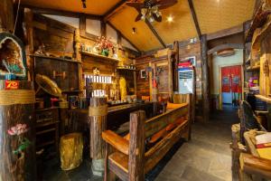 The lounge or bar area at Butterfly Flowers Inn