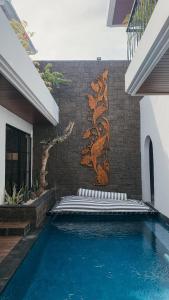 Piscina a The Wina Villa Canggu o a prop