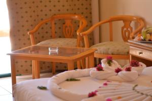 a toy room with two chairs and a table at Sharm Cliff Hotel in Sharm El Sheikh