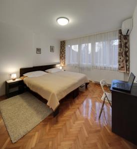 Postel nebo postele na pokoji v ubytování Apartment Osijek-Tvrda