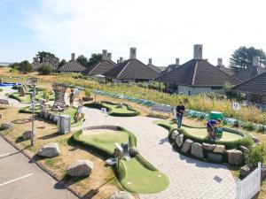 un parque infantil con campos de minigolf en 6 person holiday home on a holiday park in Karreb ksminde en Karrebæksminde