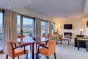 a living room with a table and chairs at Sheraton Salta Hotel in Salta