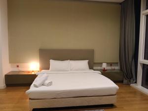 Кровать или кровати в номере Platinum luxury Suites KLCC