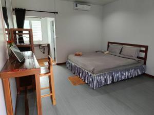 Ліжко або ліжка в номері Lovely Paradise Phangan Hotel