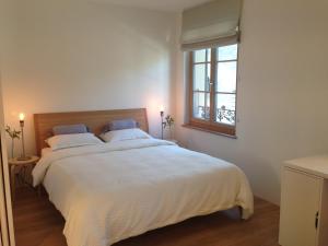 Posteľ alebo postele v izbe v ubytovaní Carouge Loft Apartment