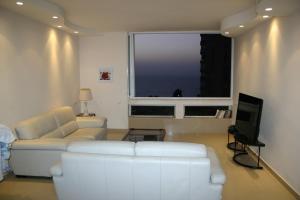 Ein Sitzbereich in der Unterkunft Ocean View Luxury apartment