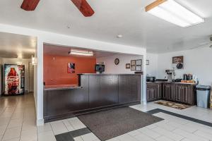 a large room with a counter and a kitchen at Motel 6-Beaver, UT in Beaver