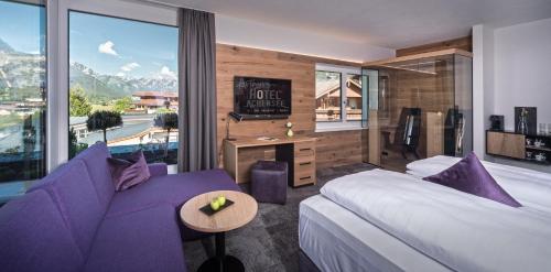 Cama ou camas em um quarto em Arthur's Hotel und Apartments am Achensee