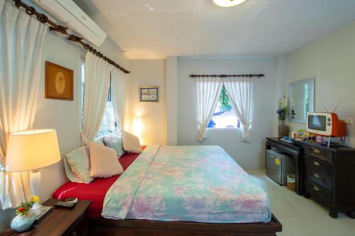 Кровать или кровати в номере Banyan House Samui bed and breakfast (Adult Only)