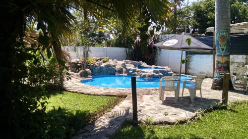 The swimming pool at or close to El Jardin Colonial