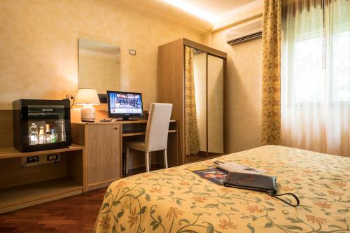 Voodi või voodid majutusasutuse Hotel Vega Perugia toas