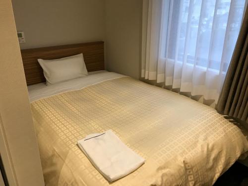 Letto o letti in una camera di Hotel Crown Hills Iwaki