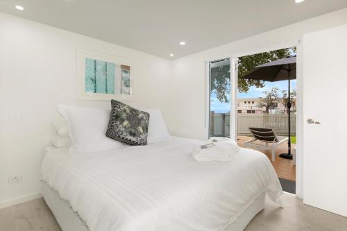 Кровать или кровати в номере The Beach House North Wollongong